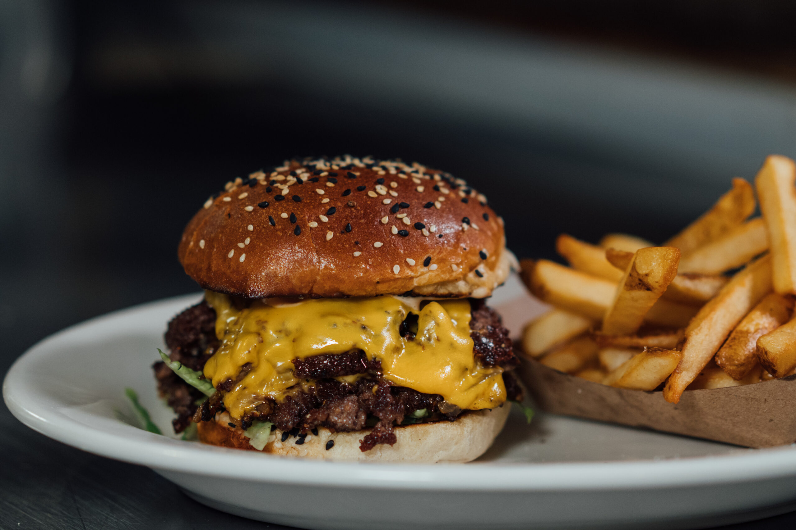 a cheeseburger and fries on a plate - Camps Kitchen & Bar, Marietta, GA